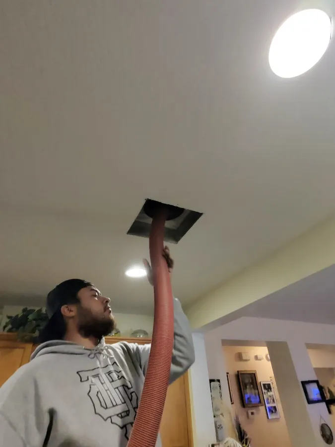 ABC Water & Air technician cleaning air ducts